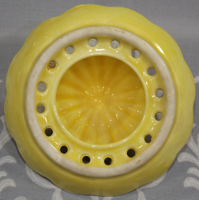 Bottom view of small yellow Carlton Ware juicer top