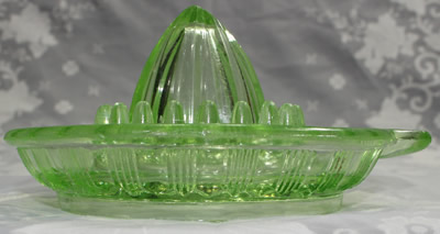 The end view of a Crown Crystal Glass Type 1 green glass juicer