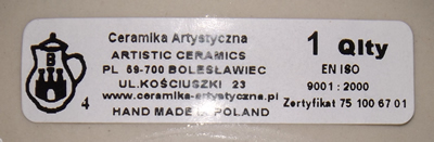 Paper label on a blue swirls on white Poland ceramic juicer