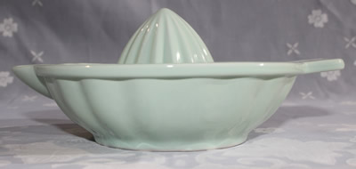 Side view of a 1 piece mint green Ambrosia AYA juicer