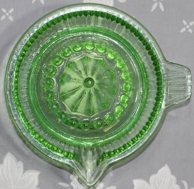 Top view of a Wheel&Barrow Chinese green glass ribbed juicer