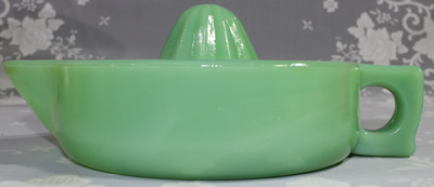 Side view of a modern jadeite glass 1 piece juicer