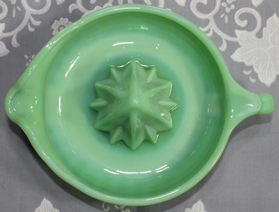 Top view of a TableCraft jadeite loop handle juicer