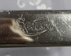 The inscribed name on a Senso stainless steel squeezer juicer