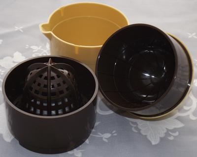 3 pieces of cream and brown plastic squeezer juicer