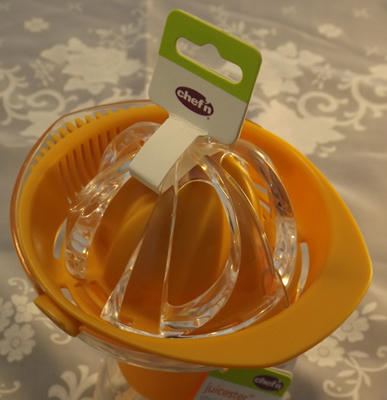 The label on an orange and clear plastic measure Chef'n juicer 