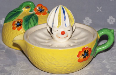 Showing the clown in a 3 piece yellow clown juicer