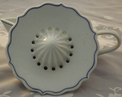 Top of  large blue and white 2 piece juicer