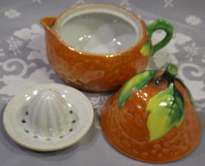 3 parts of orange, yellow and green pear shape juicer