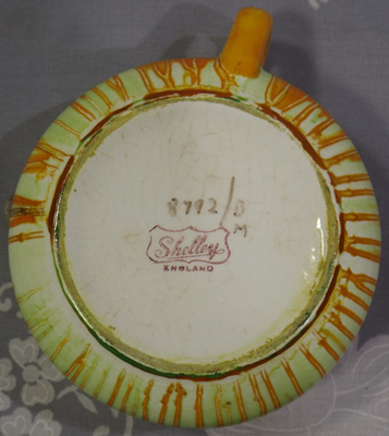 Orange and pink Shelley dripware juicer base showing backstamp 