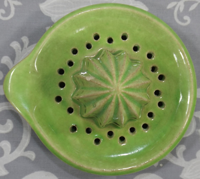 Top view of a green ceramic reamer with grip