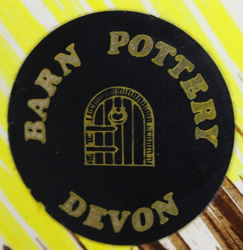 Sticker on yellow and brown Barn Pottery ceramic juicer