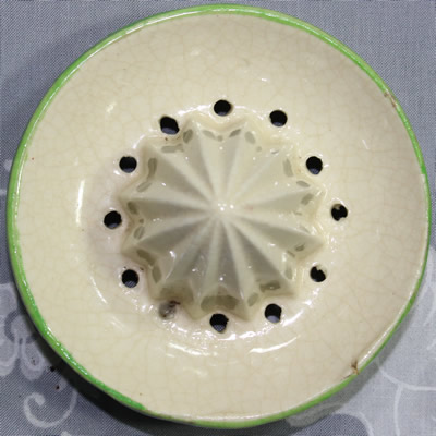 The reamer for an yellow peel, green and white ceramic juicer