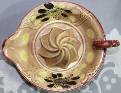 Top view of a flowers and lemons spiral cone ceramic juicer