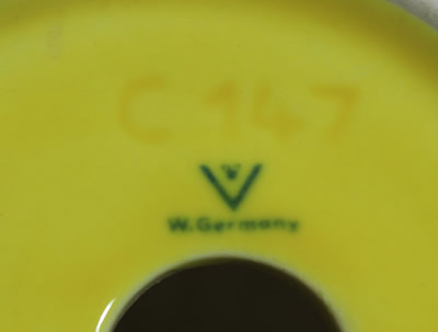 One line W. Germany bee basemark on a Goebel yellow pocket strainer juicer 