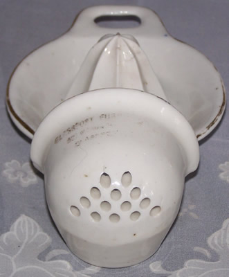 Showing the strainer on a white Corns China strainer juicer