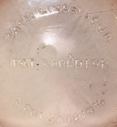 The description on the base of a 2 piece amber U.S.Glass Co. juicer set with a 'tear drop' handle