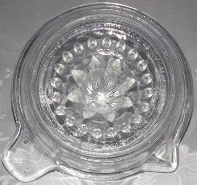 Embossed base of Clear Canton Glass juicer