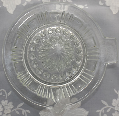 Top view of a Vereinigte Lausitzer Glaswerke flat rim clear glass juicer