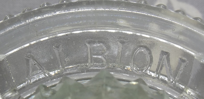 Embossed Albion on a clear glass juicer