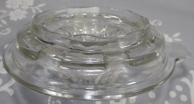 Bottom view of a large Anchor Hocking clear glass 2 piece reamer