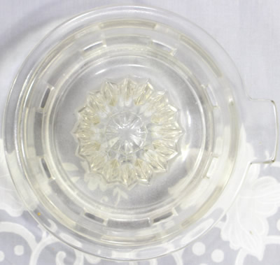 Top view of a Hazel Atlas Glass Co. clear glass juicer top