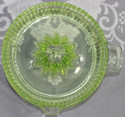 Top view of an Anchor Hocking Glass Co. green glass fluted bowl juicer