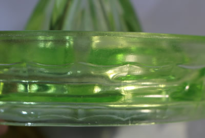 The curved panels on an Anchor Hocking Glass Company green glass juicer