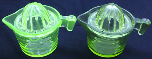 Both the uranium glass and green glass Crown Crystal Glass 2 cup juicer sets under UV light.