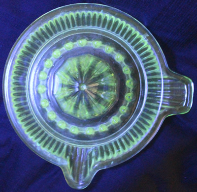 Davidson Glass saucer shape green glass juicer under UV light 