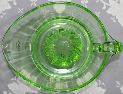 Top view of a green L. E. Smith Glass reproduction juicer