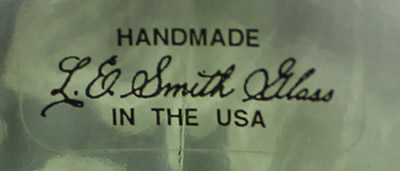 The label on a green L. E. Smith Glass reproduction juicer