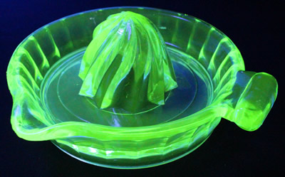 Top view of a clockwise spiral 1 piece apple green glass juicer