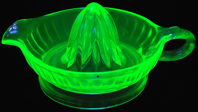 Light green Anchor Hocking Glass Company juicer under UV light