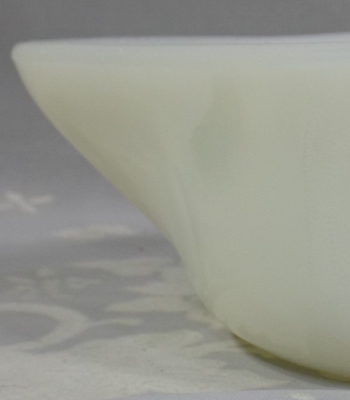 Pouring spout on an Indiana Glass Company blocked Sunkist white milk glass juicer