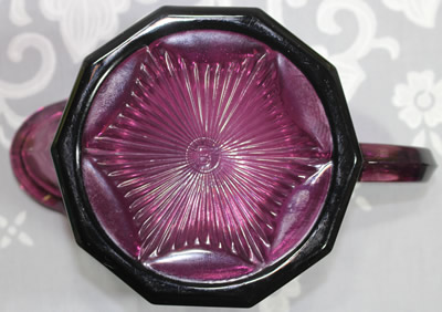 Bottom view of a 'Cranberry Ice ' glass Edna Barnes 2 piece juicer