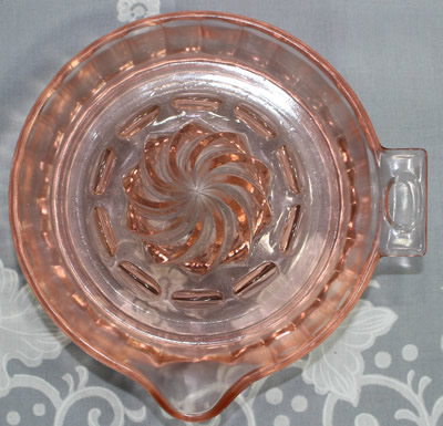 Top view of a pink Hazel Atlas panelled juicer 