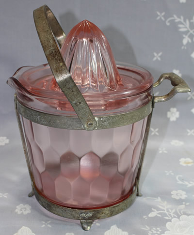 An engraved frame for a pink Jeannette ice bucket juicer