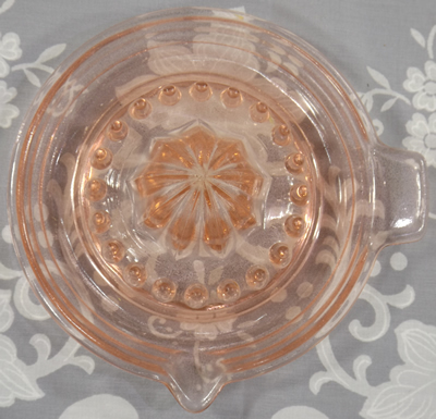 Top view of a BVB 1 piece pink glass banded juicer 