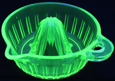 A yellow (Uranium) heat resisting glass Fry juicer under UV light