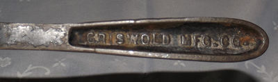 Embossing Griswold Manufacturing Company squeezer