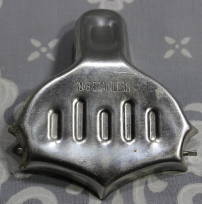 The back of a pointed spout stainless steel wedge squeezer