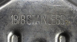 The incised mark on a pointed spout stainless steel wedge squeezer