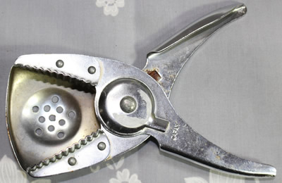 An open Japan stainless steel plier like squeezer