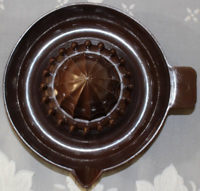 Top view of a dark brown British Plastics Pty Ltd - Melbourne (Australia) plastic saucer juicer