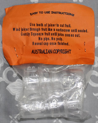 The back of the packaging for capped clear plastic 'Clever Dick Juicer' insert juicer