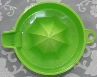 Lime green plastic juicer top view