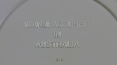 Embossed base of a Vital 3 piece white and grey hand juicer