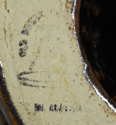 Base mark of Old Ballarat black pottery juicer with brown highlights