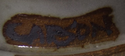 Potter's signature on Grey with brown highlights hand thrown pottery juicer